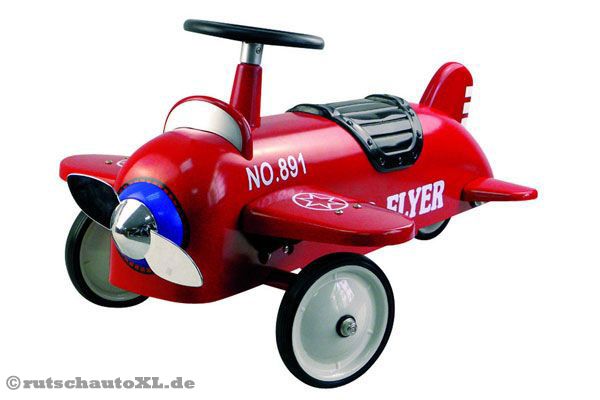 Rotes Metall Rutschauto in der Form eines Flugzeugs.
